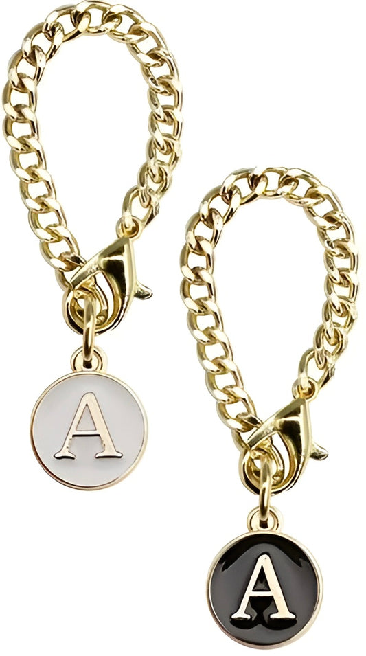 Initial letter cup charm for tumbler handles, gold chain accessory with black and white charm details 
